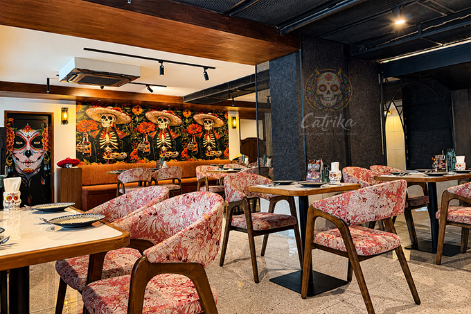 Dinner places in Bangkok: The interior of Catrina Mexican restaurant with Day of the Dead murals.
