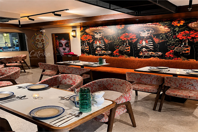 Dinner places in Bangkok: The interior of Catrina Mexican restaurant with Day of the Dead murals.